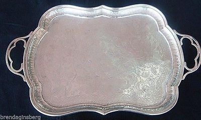 Серебряный поднос в элементами русского стиля (ручки, орнамент по краю изделия) 1882-1899 гг.